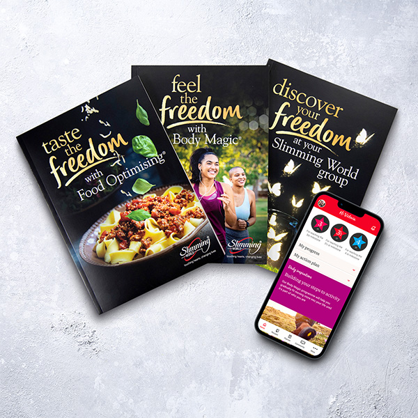 Slimming World new member pack and mobile phone screen showing the Slimming World website