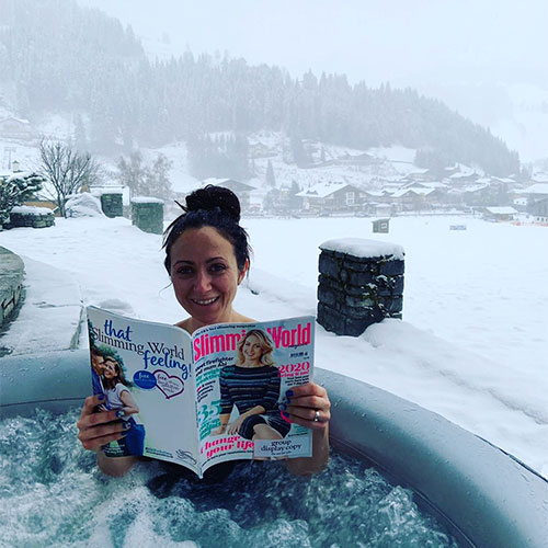 Slimming World Consultant Zoe reading Slimming World magazine in a hot tub