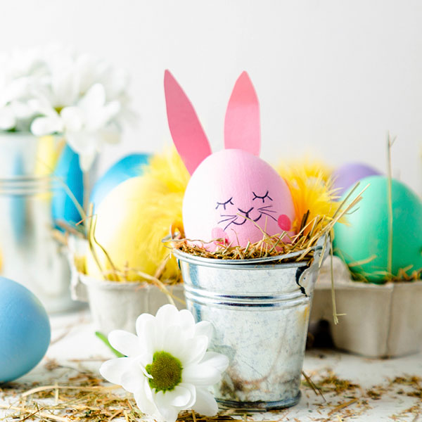 pink bunny rabbit easter egg in a silver bucket