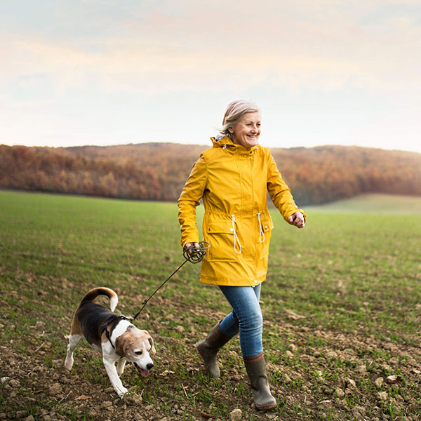 Woman running with dog-4 ways to reduce dementia risk-slimming world blog
