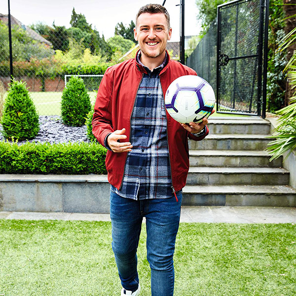 Aaron Snares walking holding football-16st weight loss-slimming world blog