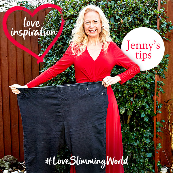 Slimming World member Jenny Irons holding an old pair of large jeans