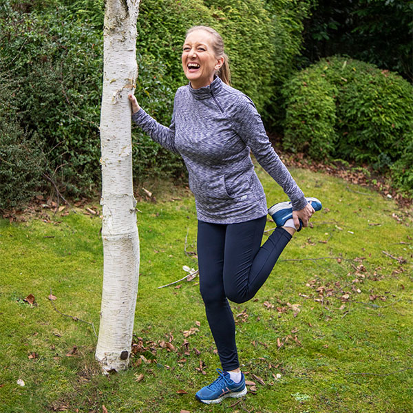 Slimming World member Shelley stretching after a run